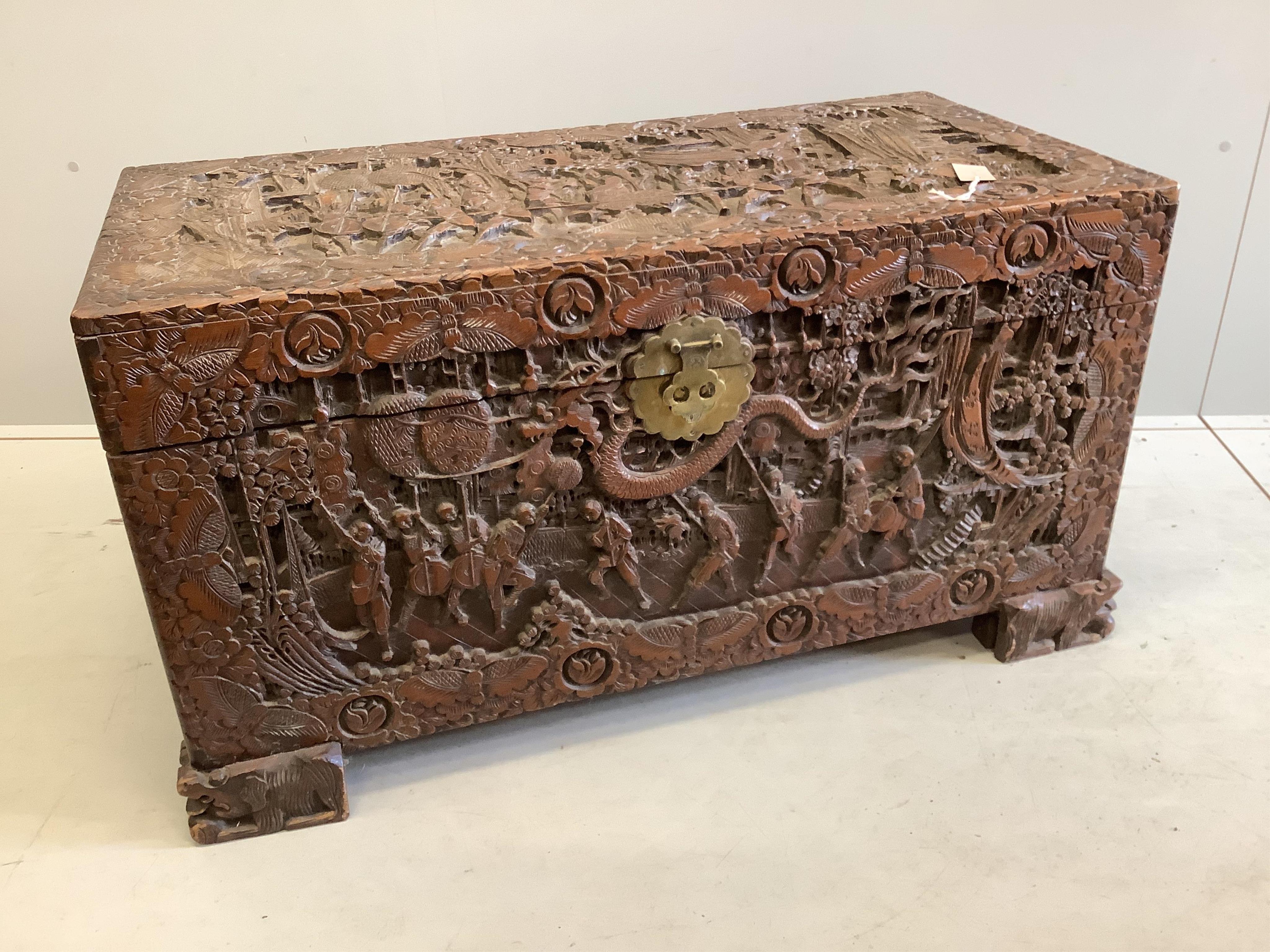 A Chinese carved camphor wood trunk, width 104cm, depth 51cm, height 57cm. Condition - fair